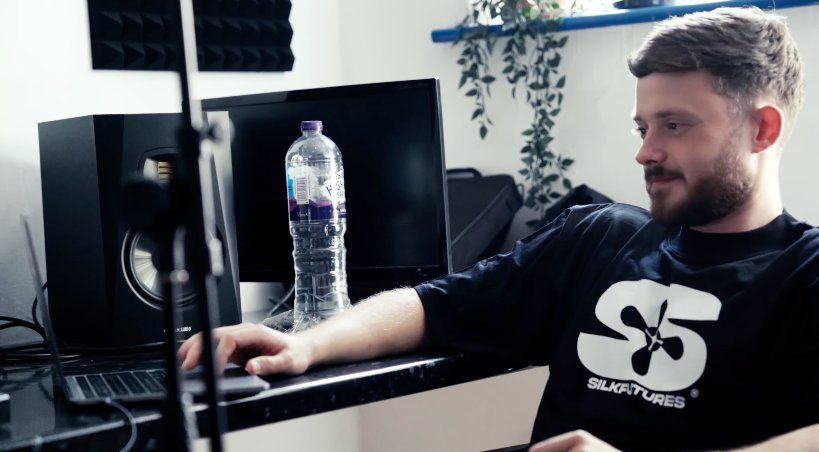 Benny at the mixing desk — Silkfutures branded, focused on production