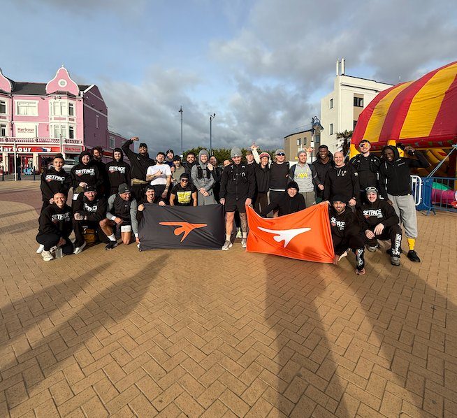 Set Pace Adults community — group photo with Set Pace flags