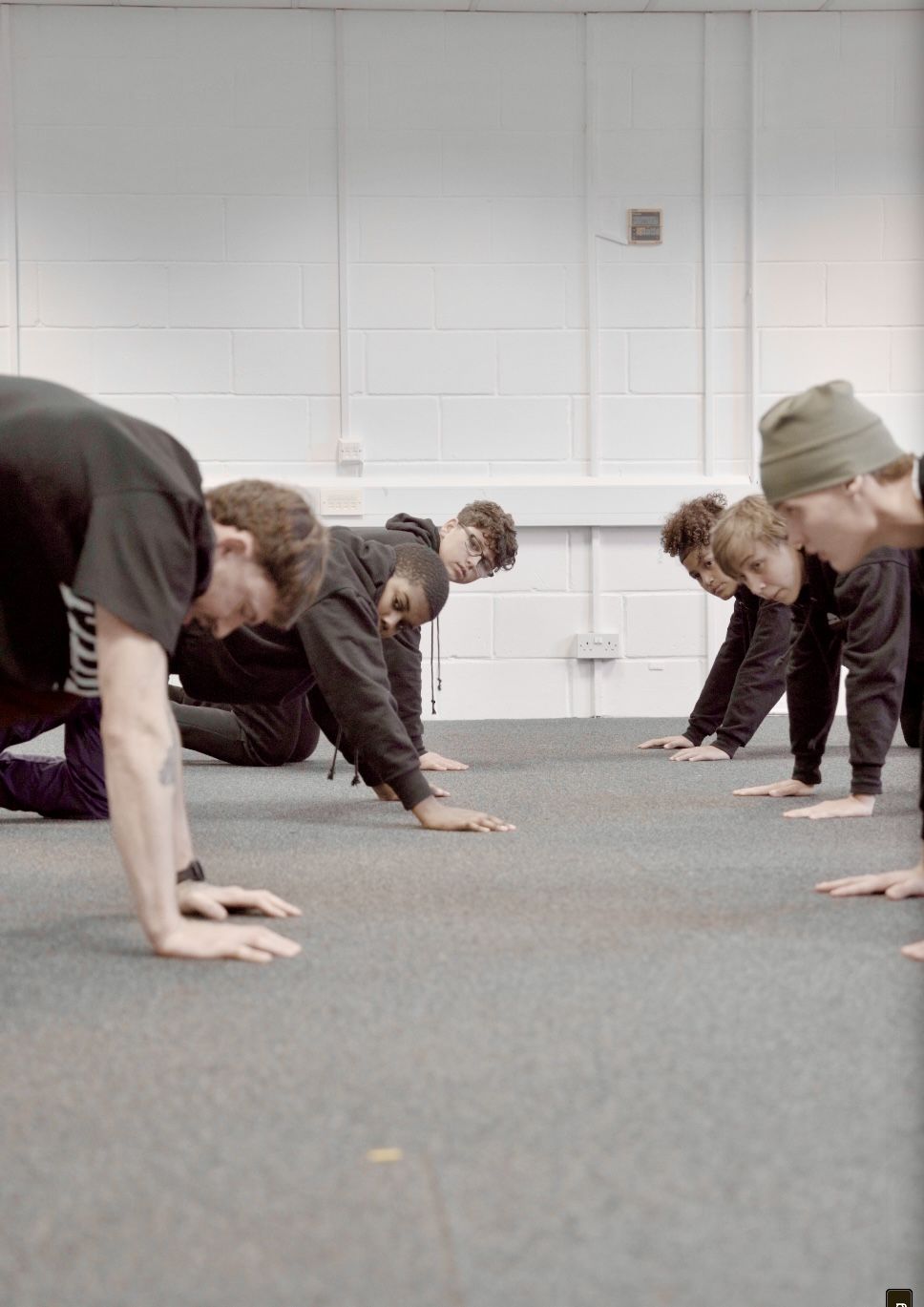 Push-up line — mentors and young people training side by side